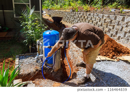 Pipes in trench are ready for connection to home well water system Pipes in trench are ready for connection to home well water system 116464839