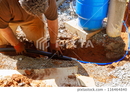 Plumbing technician applied thermal insulation isolation to water pvc pipes before installing them Plumbing technician applied thermal insulation isolation to water pvc pipes before installing them 116464840