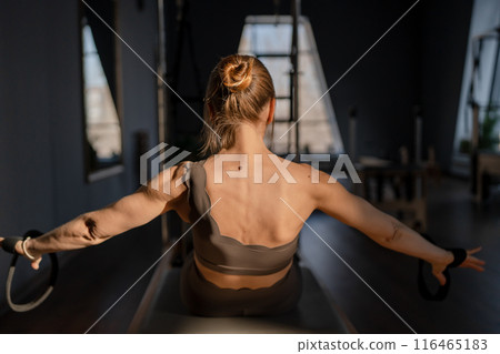 Modern Pilates studio with bright, spacious windows for exercise and wellbeing Modern Pilates studio with bright, spacious windows for exercise and wellbeing 116465183