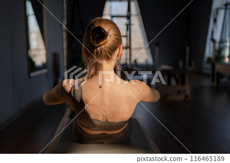 Modern Pilates studio with bright, spacious windows for exercise and wellbeing Modern Pilates studio with bright, spacious windows for exercise and wellbeing 116465189