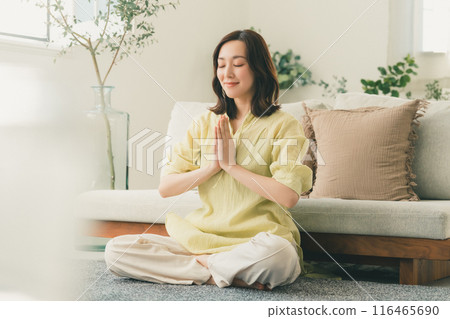 Yoga in the living room 116465690