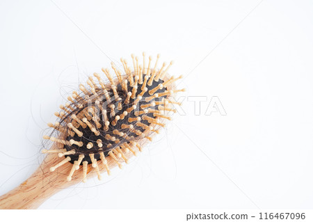 Hair loss fall with comb brush isolated on white background. 116467096