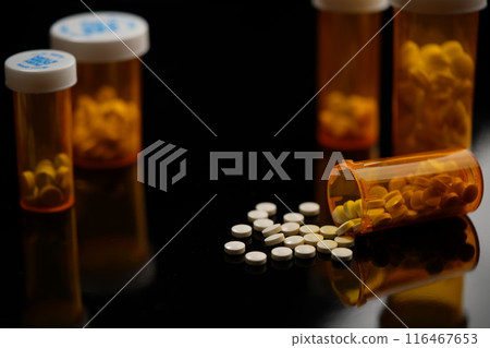 Tablets in pill case 116467653