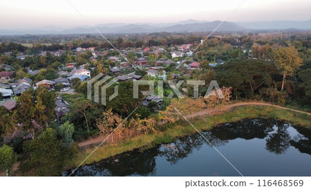 Aerial view of rice field and village in the countryside 116468569