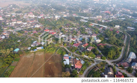 Aerial view of rice field and village in the countryside Aerial view of rice field and village in the countryside 116468572