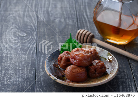 Kishu Nanko Plums Pickled in Honey (Honey Umeboshi) Black Background 116468970