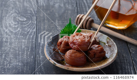 Kishu Nanko Plums Pickled in Honey (Honey Umeboshi) Black Background 116468974