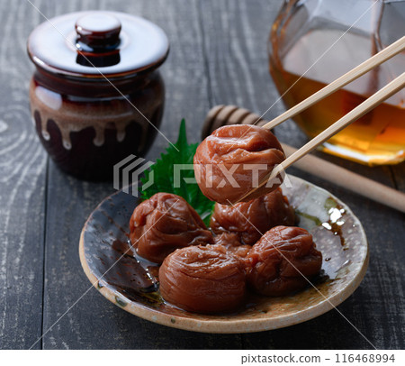 Kishu Nanko Plums Pickled in Honey (Honey Umeboshi) Black Background Kishu Nanko Plums Pickled in Honey (Honey Umeboshi) Black Background 116468994