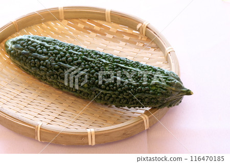 Fresh bitter melon served in a colander Fresh bitter melon served in a colander 116470185