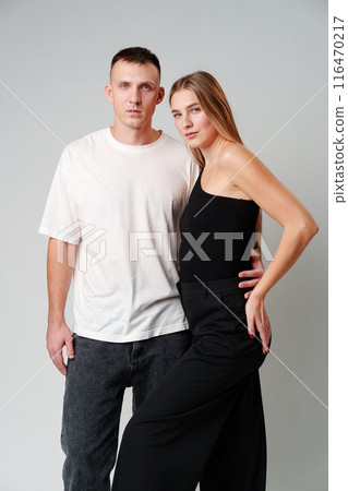 A Man and a Woman Standing Next to Each Other in studio A Man and a Woman Standing Next to Each Other in studio 116470217
