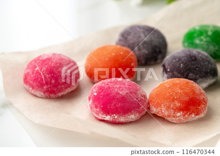 Multi-colored Japanese cakes Mochi in a white plate Multi-colored Japanese cakes Mochi in a white plate 116470344