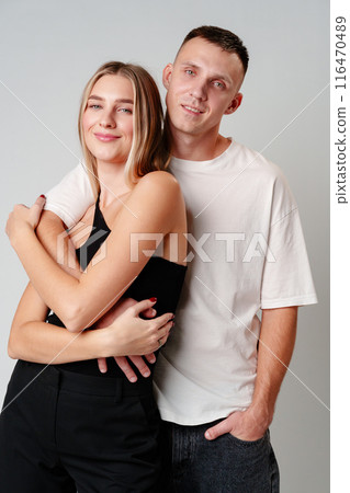 A Man and a Woman Standing Next to Each Other in studio A Man and a Woman Standing Next to Each Other in studio 116470489