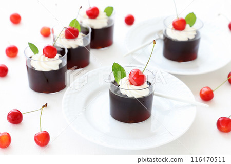 Coffee jelly topped with cherries and fresh cream 116470511