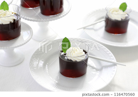 Coffee jelly topped with fresh cream and mint Coffee jelly topped with fresh cream and mint 116470560