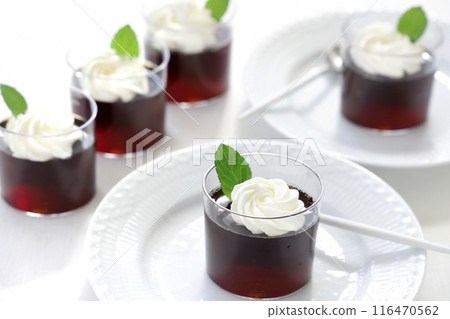 Coffee jelly topped with fresh cream and mint Coffee jelly topped with fresh cream and mint 116470562