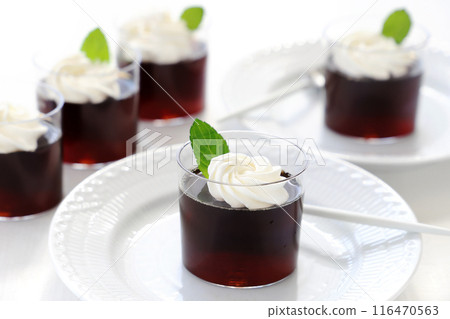Coffee jelly topped with fresh cream and mint Coffee jelly topped with fresh cream and mint 116470563