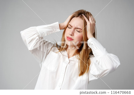 Woman With Hands on Head Suffering Headache Woman With Hands on Head Suffering Headache 116470668