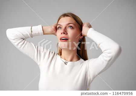 Young Woman Posing for Picture on gray background 116470956