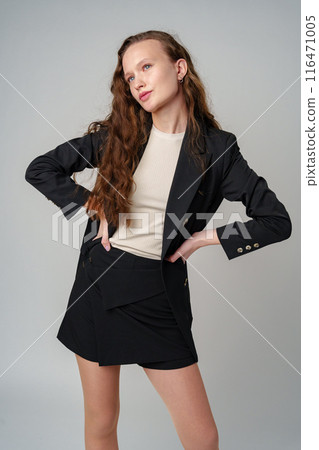 Woman With Long Hair and Blue Eyes on gray background Woman With Long Hair and Blue Eyes on gray background 116471005