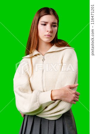 Young Woman Contemplating Deeply Against a Vibrant Green Background Young Woman Contemplating Deeply Against a Vibrant Green Background 116471201