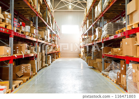 Modern warehouse shelves with pile of cardboard boxes 116471803