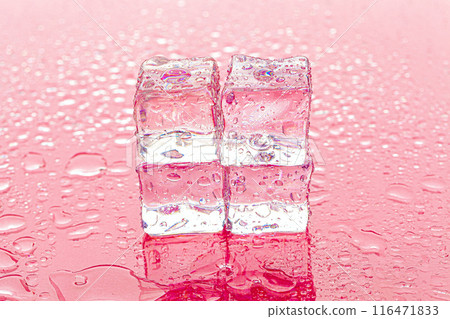 Fozen ice cubes on wet pink background 116471833