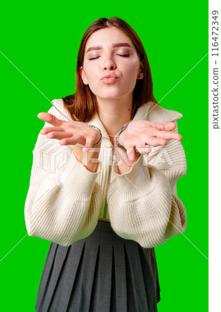 Woman in White Sweater Making Hand Gesture Woman in White Sweater Making Hand Gesture 116472349