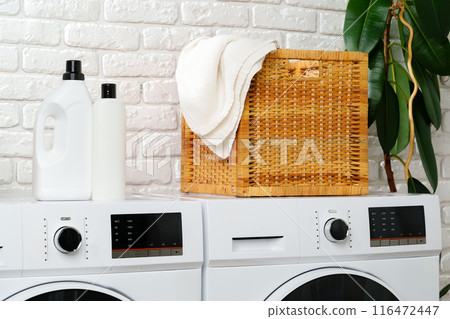 White Laundry Appliances in a Modern Bathroom With White Brick Wall 116472447