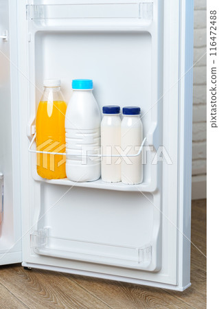 Open Refrigerator Door With Juice, Milk, and Fresh Produce Open Refrigerator Door With Juice, Milk, and Fresh Produce 116472488