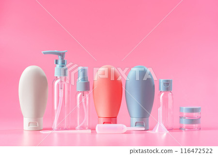 Travel-Sized Bottles of Lotion, Shampoo, and Conditioner on Pink Background Travel-Sized Bottles of Lotion, Shampoo, and Conditioner on Pink Background 116472522