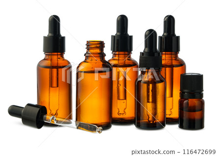 Amber Glass Bottles of Essential Oils and Cream Isolated on White Background 116472699
