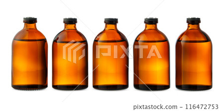Five Amber Glass Bottles With Liquid on White Background Five Amber Glass Bottles With Liquid on White Background 116472753