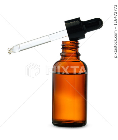 Dropper Bottle With Liquid Dropping on a White Background Dropper Bottle With Liquid Dropping on a White Background 116472772