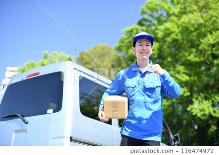 Asian male delivery driver holding luggage 116474972