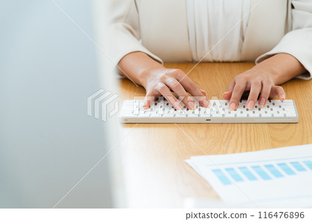 Business woman doing desk work Business woman doing desk work 116476896