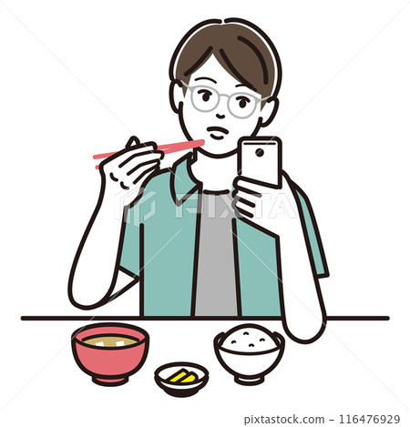 A boy eating while looking at his smartphone 116476929