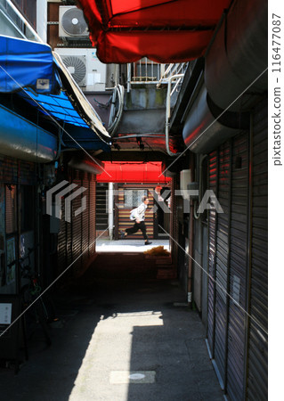 Back alley and passersby Back alley and passersby 116477087