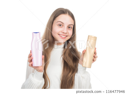 happy teen girl presenting shampoo or hair body conditioner bottle isolated on white, keratin happy teen girl presenting shampoo or hair body conditioner bottle isolated on white, keratin 116477946