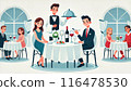 A couple dining at a restaurant with a waiter serving food 116478530