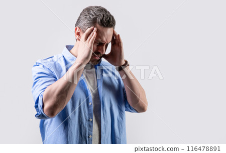 photo of man with migraine headache, copy space. man with headache or migraine wear shirt. photo of man with migraine headache, copy space. man with headache or migraine wear shirt. 116478891