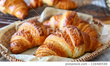 Delicious croissants topped with whipped cream and powdered sugar Delicious croissants topped with whipped cream and powdered sugar 116480580