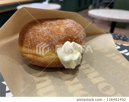 Whipped cream-filled raw donuts - fluffy sweets 116481492