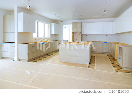 In process of constructing home improvement project, new custom kitchen cabinet is being assembled 116481693