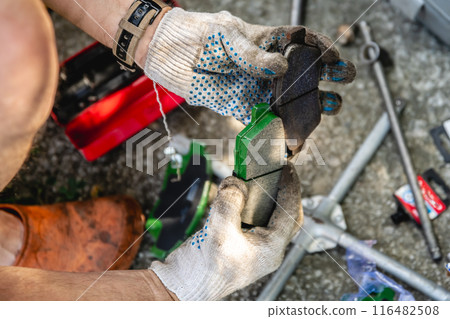 Comparison of old and new brake pads when repairing a car Comparison of old and new brake pads when repairing a car 116482508