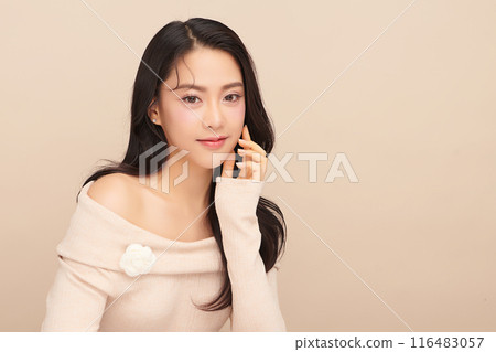Beautiful young asian woman with clean fresh skin on beige background, Face care, Facial treatment, Cosmetology, beauty and spa, Asian women portrait. 116483057