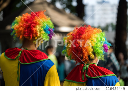 Rear of Jokers wearing colorful carnival wig, Fancy dress 116484449