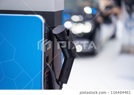 EV charging station with blur electric car. Vehicle power supply 116484461