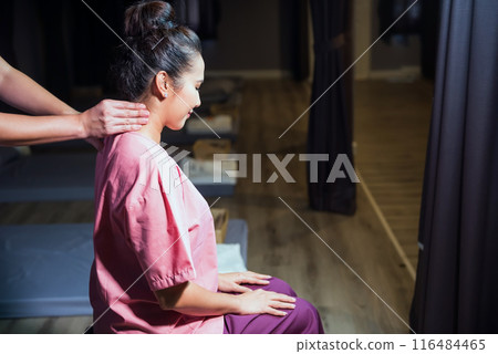 Thai neck massage reflexology therapy to woman in spa 116484465