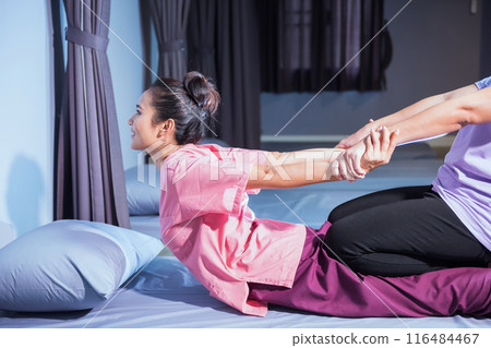 Thai massage by stretching back and hands by hermit posture Thai massage by stretching back and hands by hermit posture 116484467