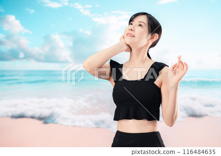 Woman in swimsuit enjoying the beach 116484635